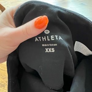 Black athleta leggings with cut outs on legs